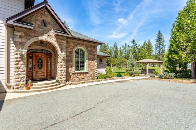 35600 Rock Creek Rd, Shingletown, CA 96088 - doorway to property with stone siding