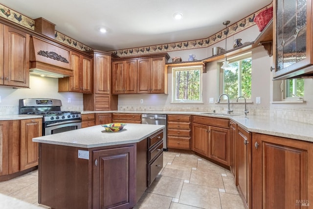 35600 Rock Creek Rd, Shingletown, CA 96088 - kitchen with glass insert cabinets, recessed lighting, brown cabinets, a sink, and appliances with stainless steel finishes