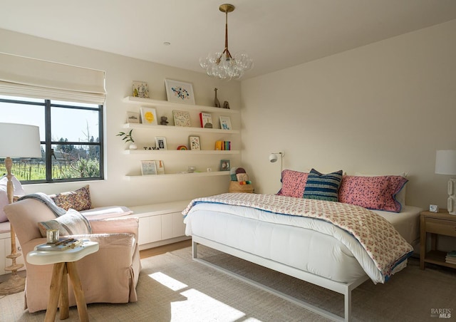 bedroom with a notable chandelier