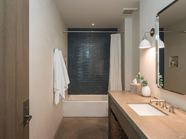 bathroom with visible vents, concrete floors, shower / bath combination with curtain, and vanity