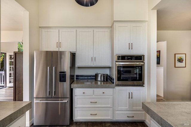 kitchen featuring white cabinets and appliances with stainless steel finishes
