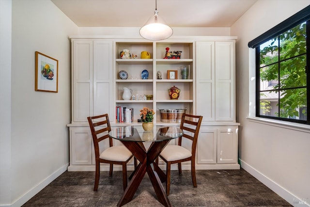 dining space with baseboards