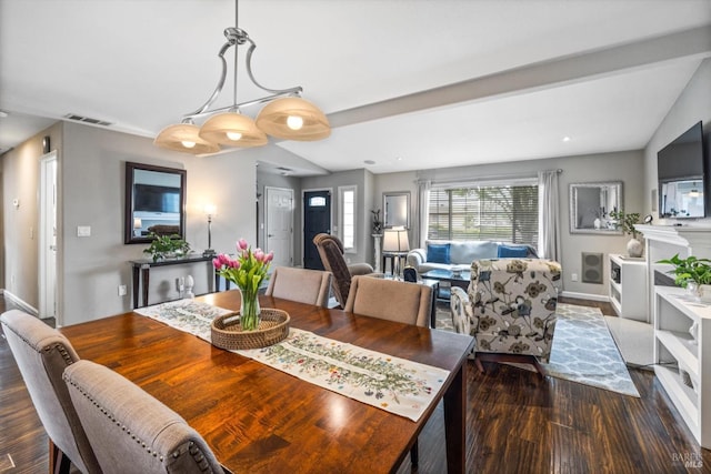 dining room featuring baseboards, dark wood-style flooring, and visible vents