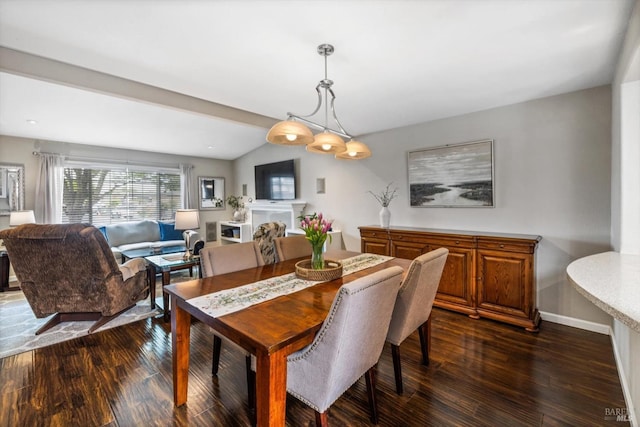 dining space with baseboards, dark wood finished floors, and a fireplace