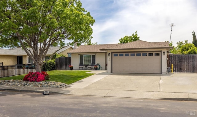 ranch-style home with concrete driveway, stucco siding, an attached garage, and fence
