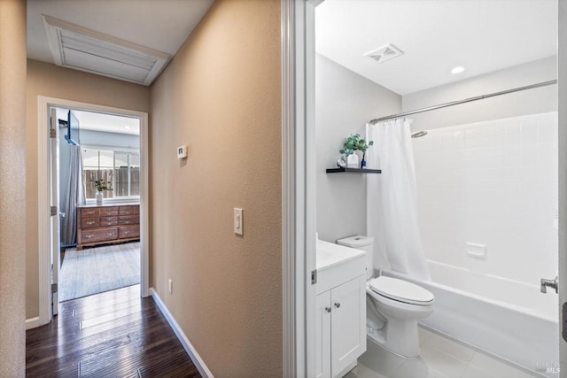 bathroom with toilet, shower / bath combo with shower curtain, visible vents, a textured wall, and vanity
