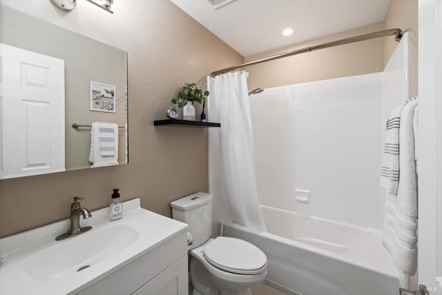 full bath featuring vanity, toilet, and shower / bath combo
