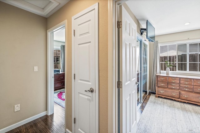 bathroom with wood finished floors and baseboards