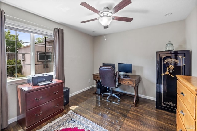 office area with dark wood-style flooring, baseboards, and ceiling fan