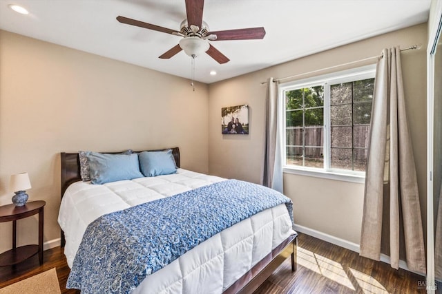 bedroom featuring wood finished floors, baseboards, a ceiling fan, and recessed lighting