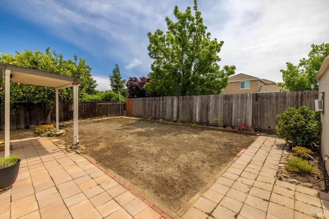 view of yard with a fenced backyard and a patio