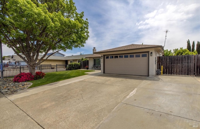 single story home with a garage, stucco siding, fence, concrete driveway, and a front lawn