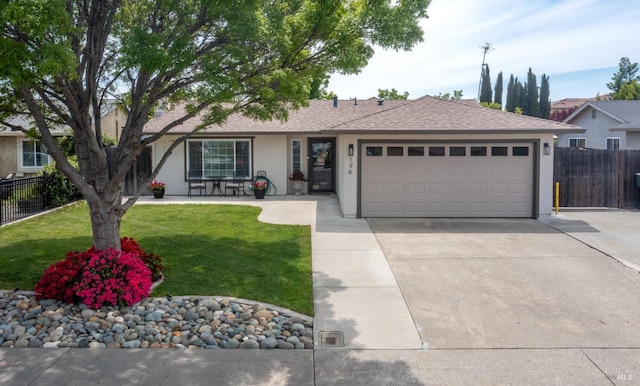 single story home featuring stucco siding, an attached garage, fence, and concrete driveway