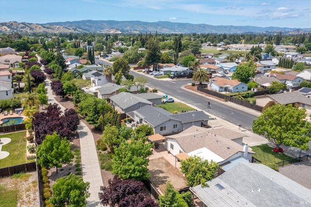 birds eye view of property with a mountain view and a residential view