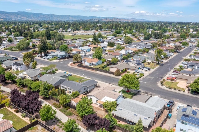 birds eye view of property featuring a mountain view and a residential view