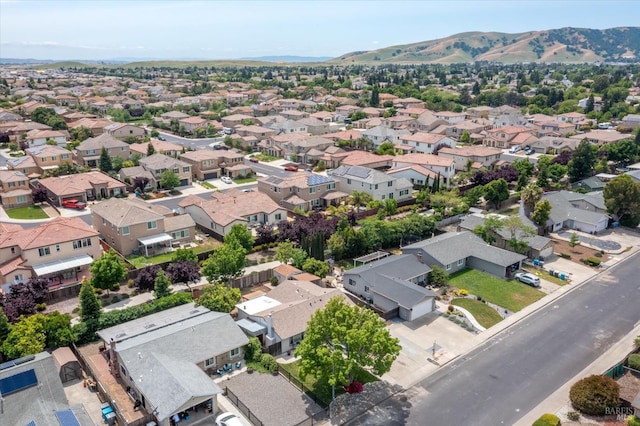 birds eye view of property with a residential view and a mountain view