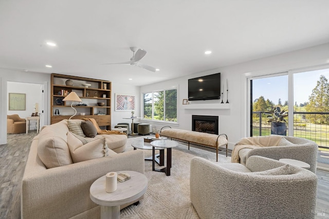 3314 Gravenstein Hwy S, Sebastopol, CA 95472 - living room featuring light wood finished floors, a fireplace, recessed lighting, and ceiling fan
