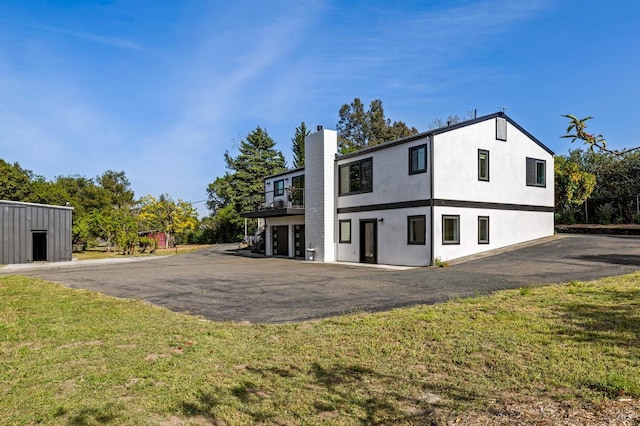 3314 Gravenstein Hwy S, Sebastopol, CA 95472 - back of property with a chimney, a yard, a balcony, and stucco siding