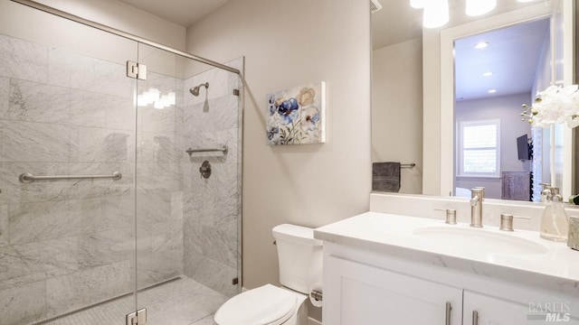 full bath featuring toilet, recessed lighting, a shower stall, and vanity