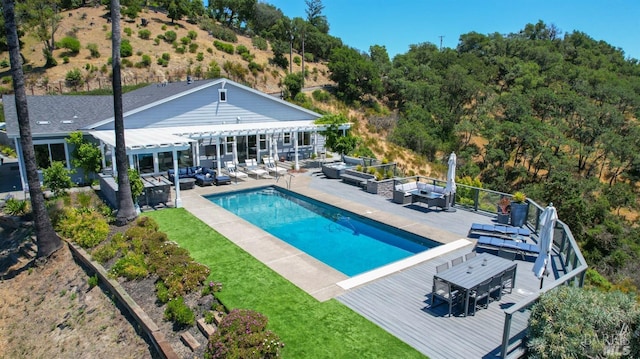 pool featuring a pergola, outdoor lounge area, outdoor dining space, and a deck