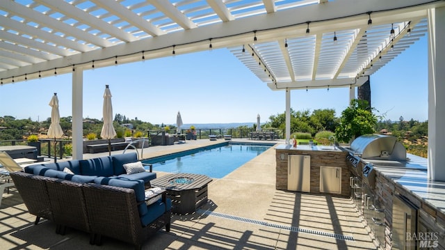 view of swimming pool featuring a pergola, a fenced in pool, an outdoor living space with a fire pit, and an outdoor kitchen