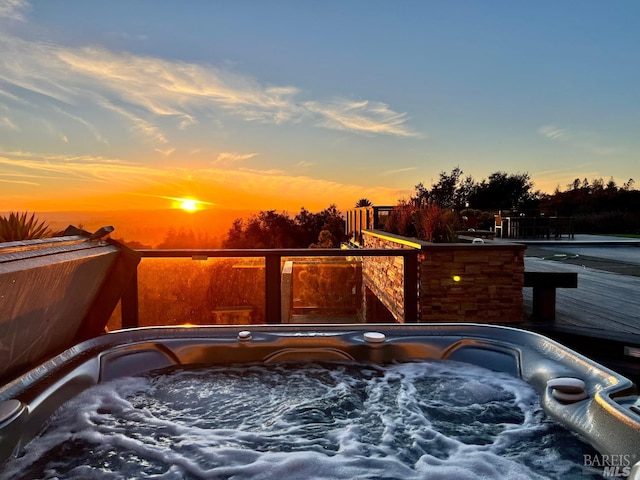 exterior space with a hot tub