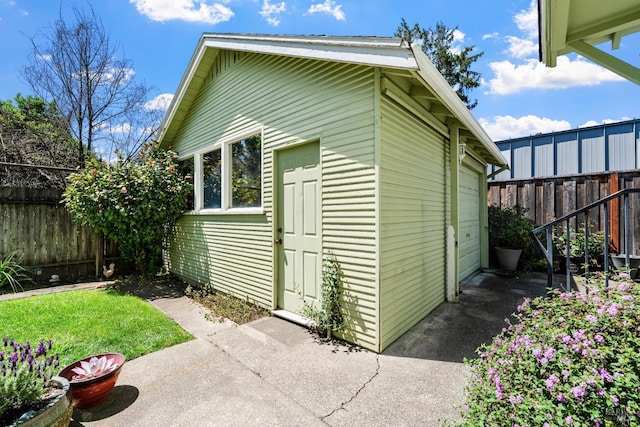 view of outdoor structure with a fenced backyard