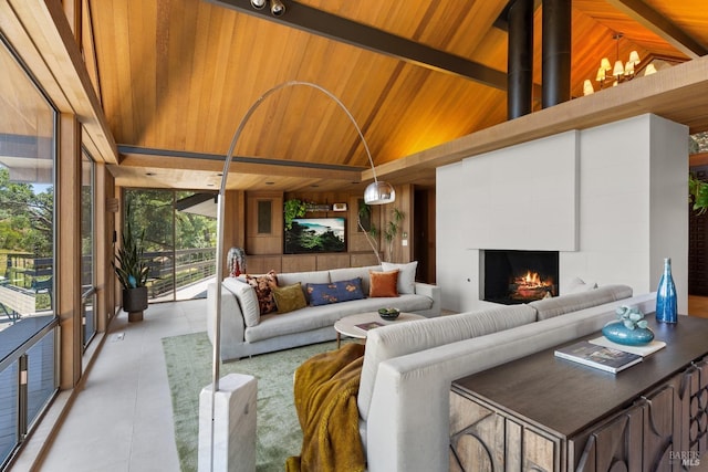 1499 Rockville Rd, Fairfield, CA 94534 - living room featuring wooden ceiling, a fireplace, wood walls, light tile patterned floors, and a chandelier