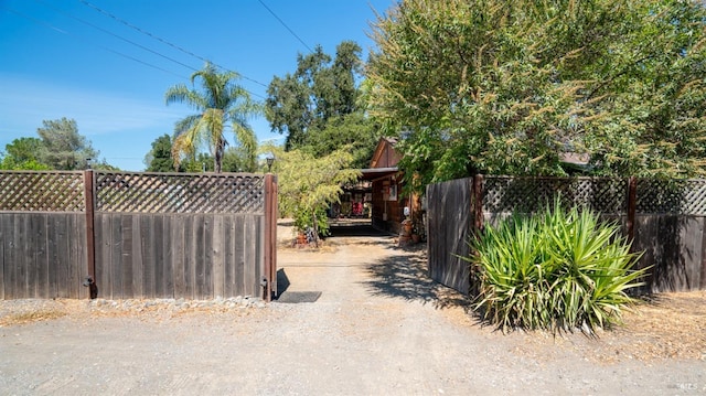 view of gate featuring fence