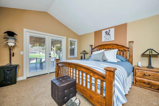 carpeted bedroom featuring access to outside, french doors, visible vents, and lofted ceiling
