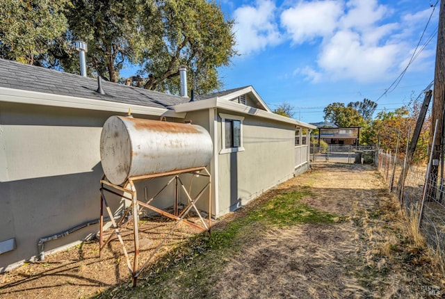 12940 1st St, Clearlake Oaks, CA 95423 - view of property exterior featuring a shingled roof