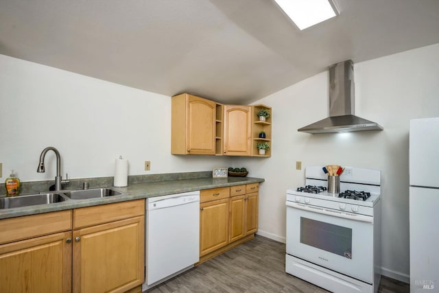 kitchen featuring wall chimney range hood, dark countertops, open shelves, a sink, and white appliances