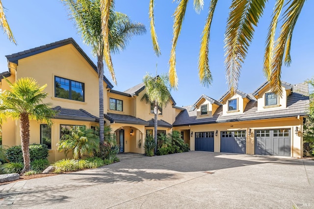220 Deer Park Ave, San Rafael, CA 94901 - view of front of house featuring concrete driveway, stucco siding, and a garage