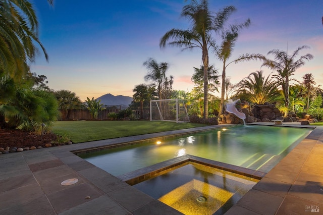 220 Deer Park Ave, San Rafael, CA 94901 - view of swimming pool with a water slide, an in-ground hot tub, an area for soccer, and fence