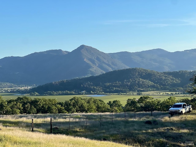 view of mountain feature with a rural view
