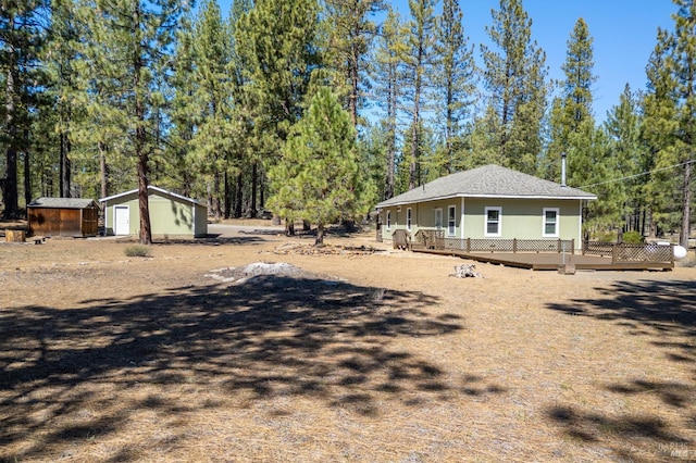 12321 Big Springs Blvd, Old Station, CA 96071 - view of side of property featuring a deck and view of wooded area