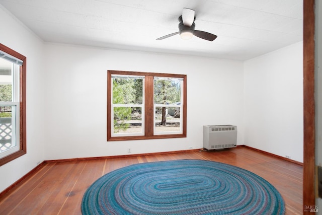 12321 Big Springs Blvd, Old Station, CA 96071 - unfurnished room with heating unit, wood finished floors, a ceiling fan, and baseboards