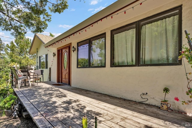 wooden deck with outdoor dining space