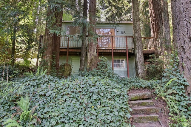 rear view of property with a deck