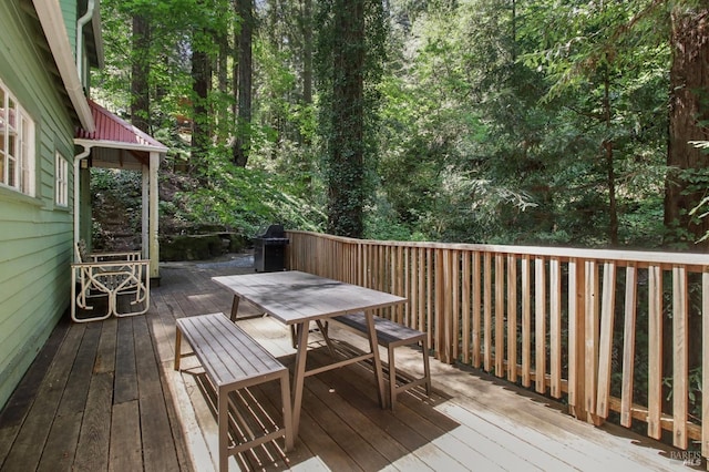 wooden deck with outdoor dining space