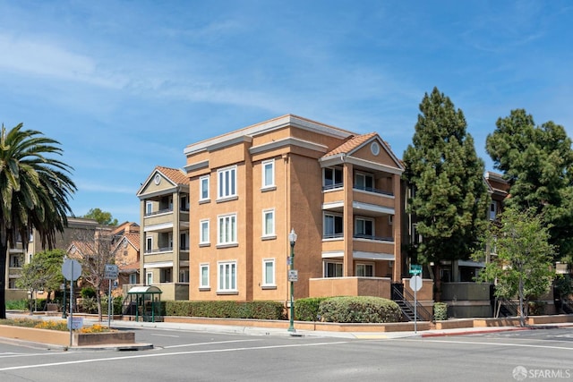 401 S Norfolk St Unit 103, San Mateo, CA 94401 - view of building exterior featuring uncovered parking
