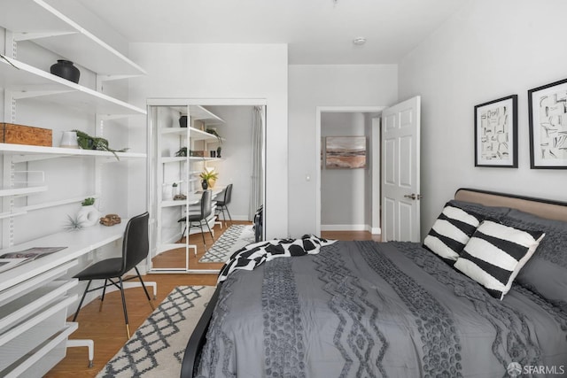 bedroom featuring wood finished floors
