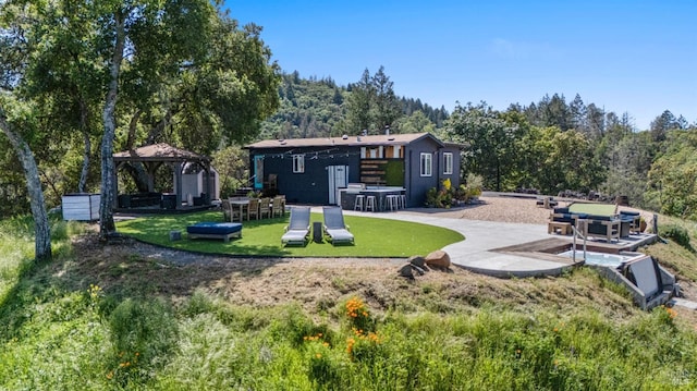 22855 Chianti Rd, Geyserville, CA 95441 - back of house with a gazebo, a lawn, and a forest view