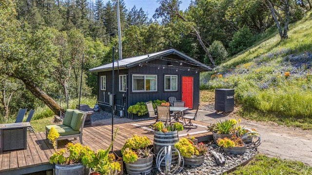 22855 Chianti Rd, Geyserville, CA 95441 - deck featuring outdoor dining area, a view of trees, and an outbuilding