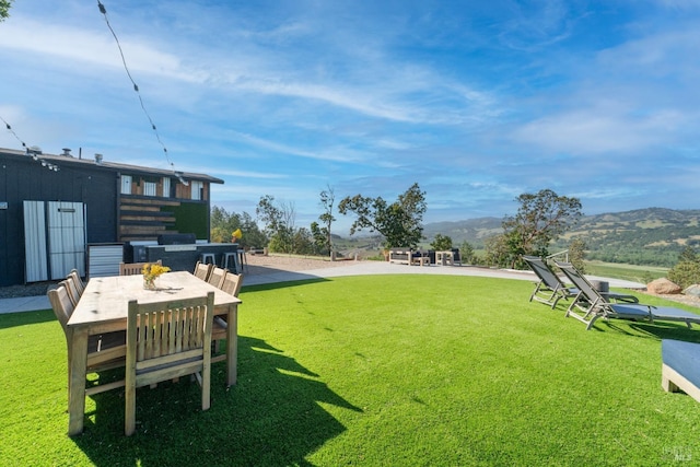 22855 Chianti Rd, Geyserville, CA 95441 - view of grassy yard with a mountain view and outdoor dining space