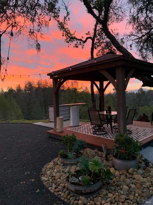 22855 Chianti Rd, Geyserville, CA 95441 - patio terrace at dusk with a gazebo and outdoor dining area
