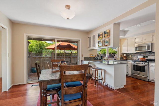 dining room featuring dark wood-style floors