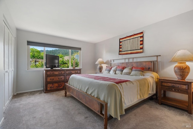 carpeted bedroom with baseboards