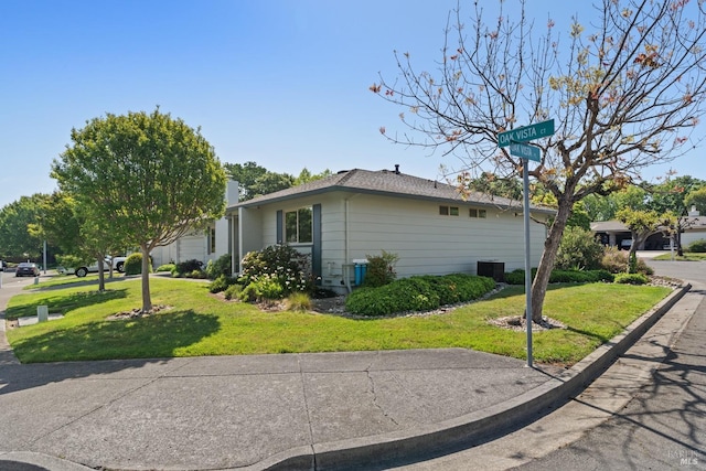 view of home's exterior featuring a lawn and central air condition unit