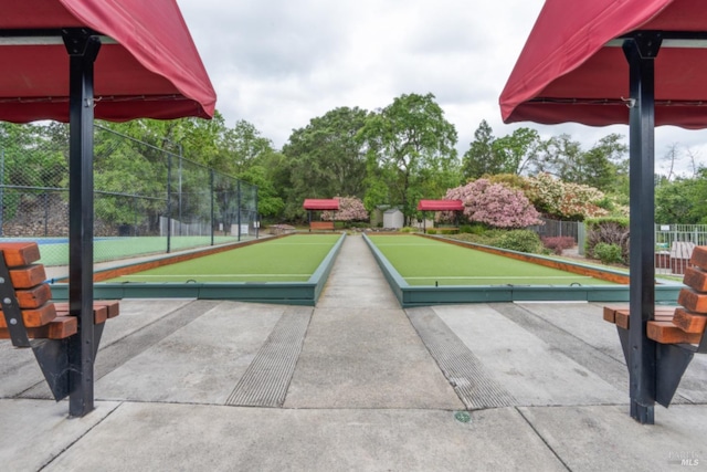 view of property's community with fence